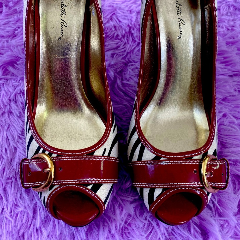 Charlotte Russe 4” high-heel zebra print shoes with deep red accents. Size 8.